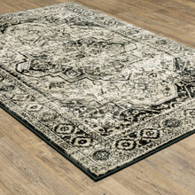 8' X 10' Black Grey Tan And Ivory Oriental Power Loom Stain Resistant Area Rug