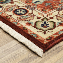 8' X 11' Red Ivory Orange And Blue Oriental Power Loom Stain Resistant Area Rug With Fringe