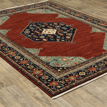 10' X 13' Red Blue Orange And Ivory Oriental Power Loom Stain Resistant Area Rug With Fringe