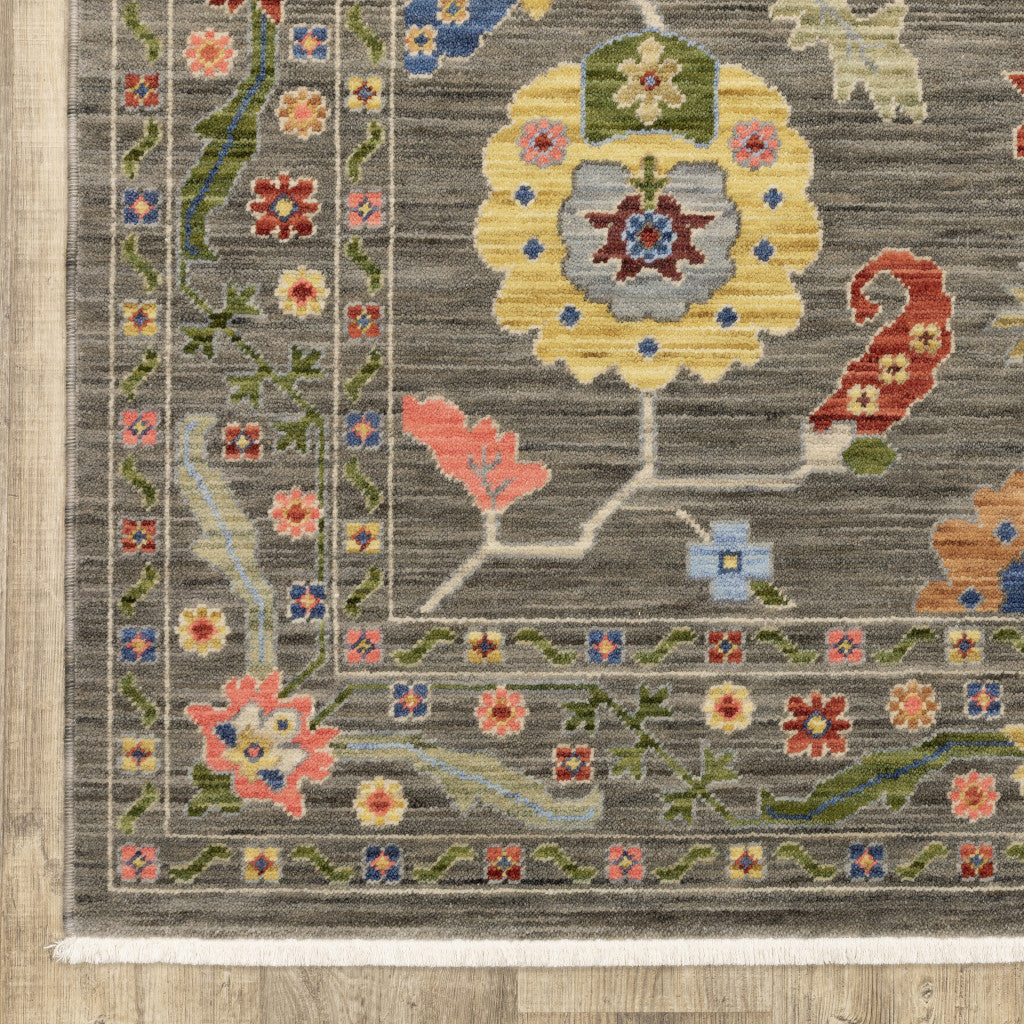 6' X 9' Grey Blue Pink Orange Rust Red Green And Ivory Oriental Power Loom Stain Resistant Area Rug With Fringe