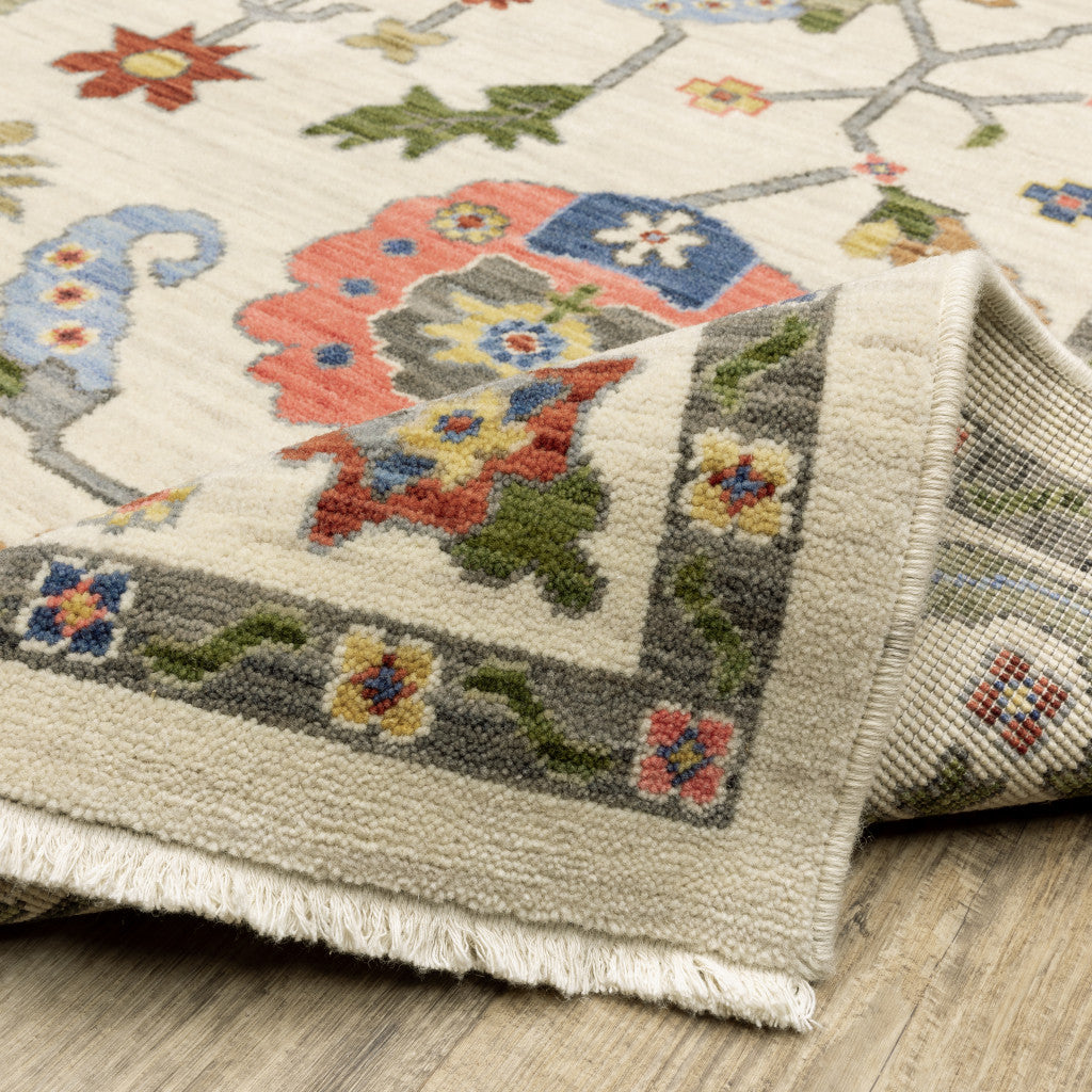 3' X 5' Ivory Green Blues Pink Yellow Rust Brown Tan And Grey Oriental Power Loom Stain Resistant Area Rug With Fringe