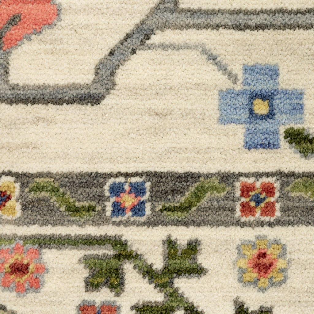 5' X 8' Ivory Green Blues Pink Yellow Rust Brown Tan And Grey Oriental Power Loom Stain Resistant Area Rug With Fringe