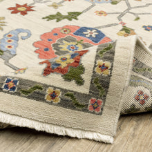 5' X 8' Ivory Green Blues Pink Yellow Rust Brown Tan And Grey Oriental Power Loom Stain Resistant Area Rug With Fringe