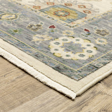3' X 5' Ivory Blue Grey Teal Gold Green And Rust Oriental Power Loom Stain Resistant Area Rug With Fringe