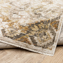 10' X 13' Gold And Ivory Oriental Power Loom Stain Resistant Area Rug With Fringe