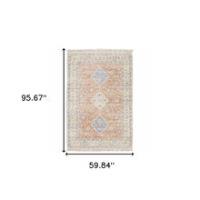 5' X 8' Orange And Blue Oriental Hand Loomed Stain Resistant Area Rug With Fringe
