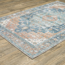 Orange Blue Teal Green And Beige Oriental Power Loom Stain Resistant Area Rug - 5' x 7'