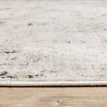 6' X 9' Ivory Grey Black Beige And Tan Abstract Power Loom Stain Resistant Area Rug