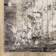 5' X 8' Grey Ivory Charcoal Tan Black And Beige Abstract Power Loom Stain Resistant Area Rug