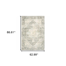 5' X 7' Grey Ivory And Blue Oriental Power Loom Stain Resistant Area Rug