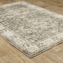 8' X 10' Grey Ivory Tan And Beige Oriental Power Loom Stain Resistant Area Rug