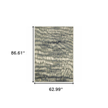 5' X 7' Grey Beige Blue And Light Blue Abstract Power Loom Stain Resistant Area Rug