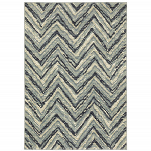 5' X 7' Blue Ivory Grey Beige And Light Blue Geometric Power Loom Stain Resistant Area Rug