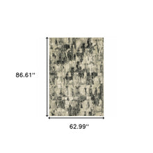 5' X 7' Grey Beige Charcoal And Blue Abstract Power Loom Stain Resistant Area Rug