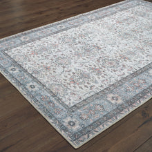 8' X 10' Ivory And Blue Oriental Power Loom Stain Resistant Area Rug