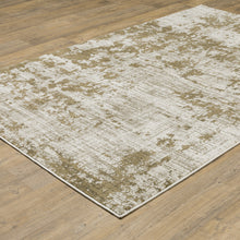 8' X 10' Beige Gold And Grey Abstract Power Loom Stain Resistant Area Rug
