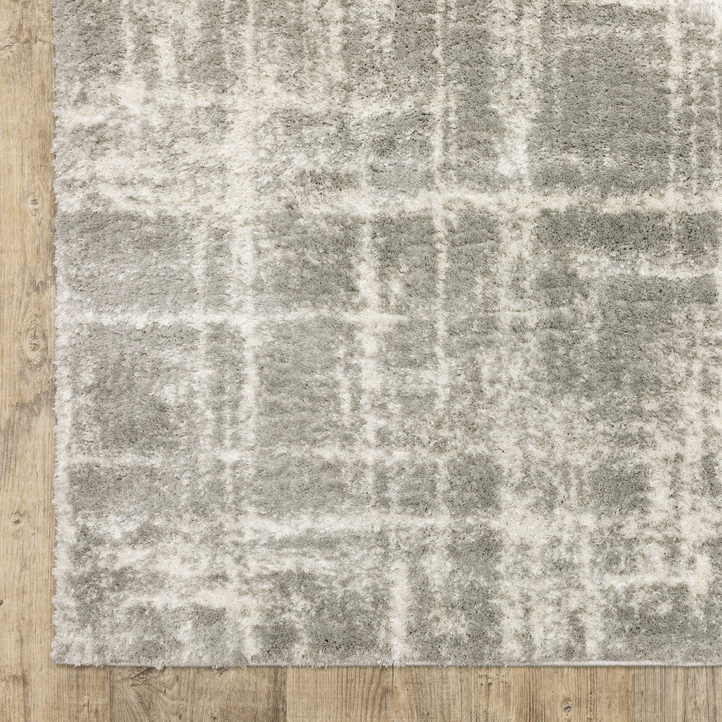 Grey And Ivory Abstract Shag Power Loom Stain Resistant Area Rug - 4' x 6'