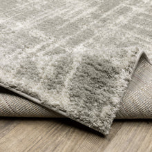 Grey And Ivory Abstract Shag Power Loom Stain Resistant Area Rug - 4' x 6'