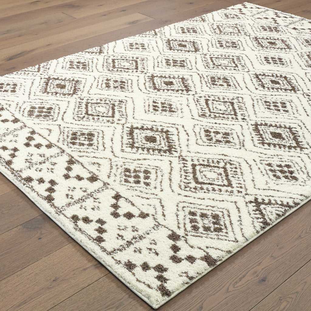 8' X 11' Ivory And Brown Geometric Shag Power Loom Stain Resistant Area Rug