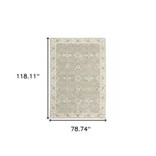 6' X 9' Grey Ivory Tan Brown And Gold Oriental Power Loom Stain Resistant Area Rug