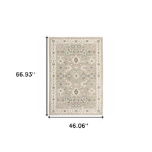 3' X 5' Beige Ivory Blue Green And Purple Oriental Power Loom Stain Resistant Area Rug