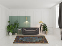 6' X 9' Blue Gold Green Red Orange And Purple Oriental Power Loom Stain Resistant Area Rug