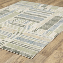5' X 7' Green Grey And Ivory Geometric Power Loom Stain Resistant Area Rug