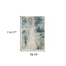 6' X 9' Blue Grey Ivory Light Blue And Dark Blue Abstract Power Loom Stain Resistant Area Rug With Fringe