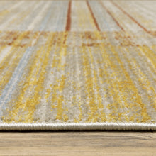 6' X 9' Rust Gold Blue Grey Ivory And Tan Geometric Power Loom Stain Resistant Area Rug With Fringe