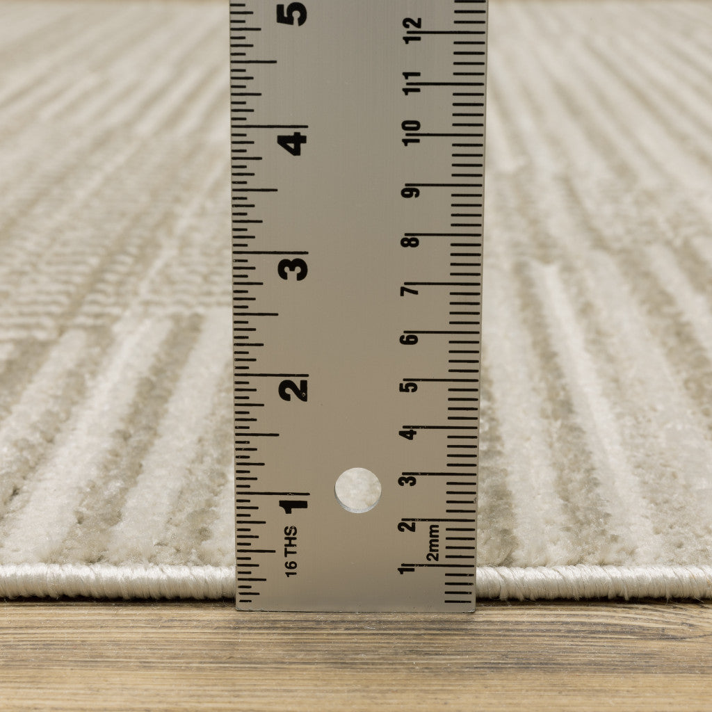 8' X 11' Ivory Beige Taupe And Tan Geometric Power Loom Stain Resistant Area Rug With Fringe