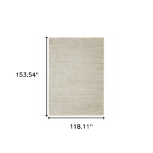 10' X 13' Ivory Beige Taupe And Tan Geometric Power Loom Stain Resistant Area Rug With Fringe