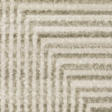 10' X 13' Ivory Beige Taupe And Tan Geometric Power Loom Stain Resistant Area Rug With Fringe