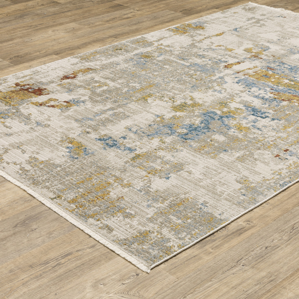 5' X 8' Beige Grey Gold Blue Rust And Teal Abstract Power Loom Stain Resistant Area Rug With Fringe