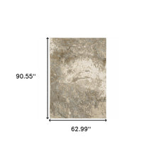 5' X 7' Grey Beige And Ivory Abstract Power Loom Stain Resistant Area Rug