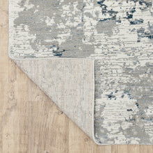 5' X 7' Blue Beige And Teal Abstract Power Loom Stain Resistant Area Rug