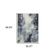 3' X 5' Navy And Ivory Abstract Power Loom Stain Resistant Area Rug