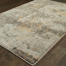 5' X 7' Grey And Gold Abstract Power Loom Stain Resistant Area Rug