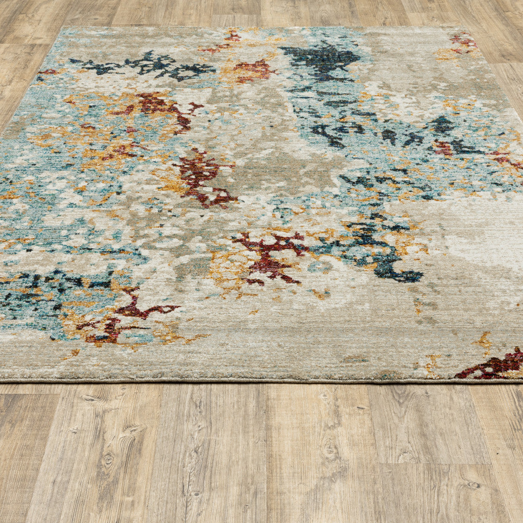 5' X 7' Beige And Blue Abstract Power Loom Stain Resistant Area Rug