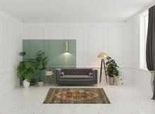 5' X 8' Red Gold Orange Green Ivory Rust And Blue Oriental Power Loom Stain Resistant Area Rug