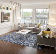 Blue Ivory And Black Floral Distressed Stain Resistant Area Rug - 2' X 4'