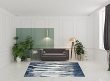 2' X 4' Ivory Blue And Gray Abstract Distressed Area Rug