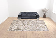 5' X 8' Brown And Ivory Abstract Stain Resistant Area Rug