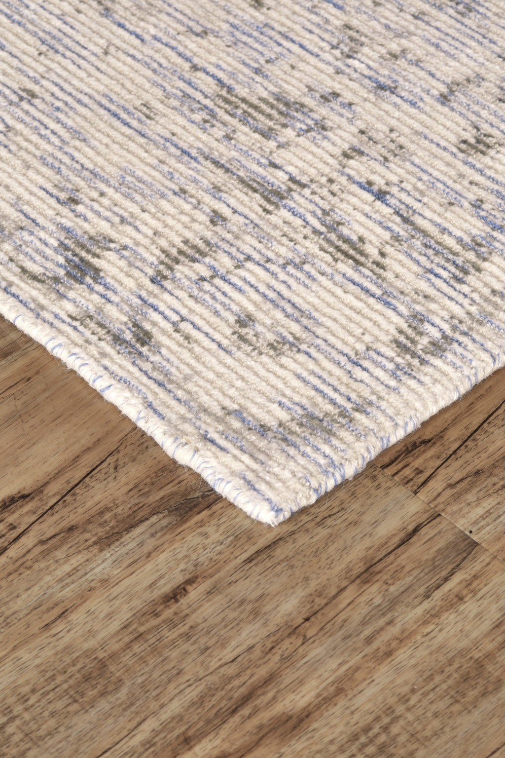 5' X 8' Ivory And Tan Abstract Hand Woven Area Rug