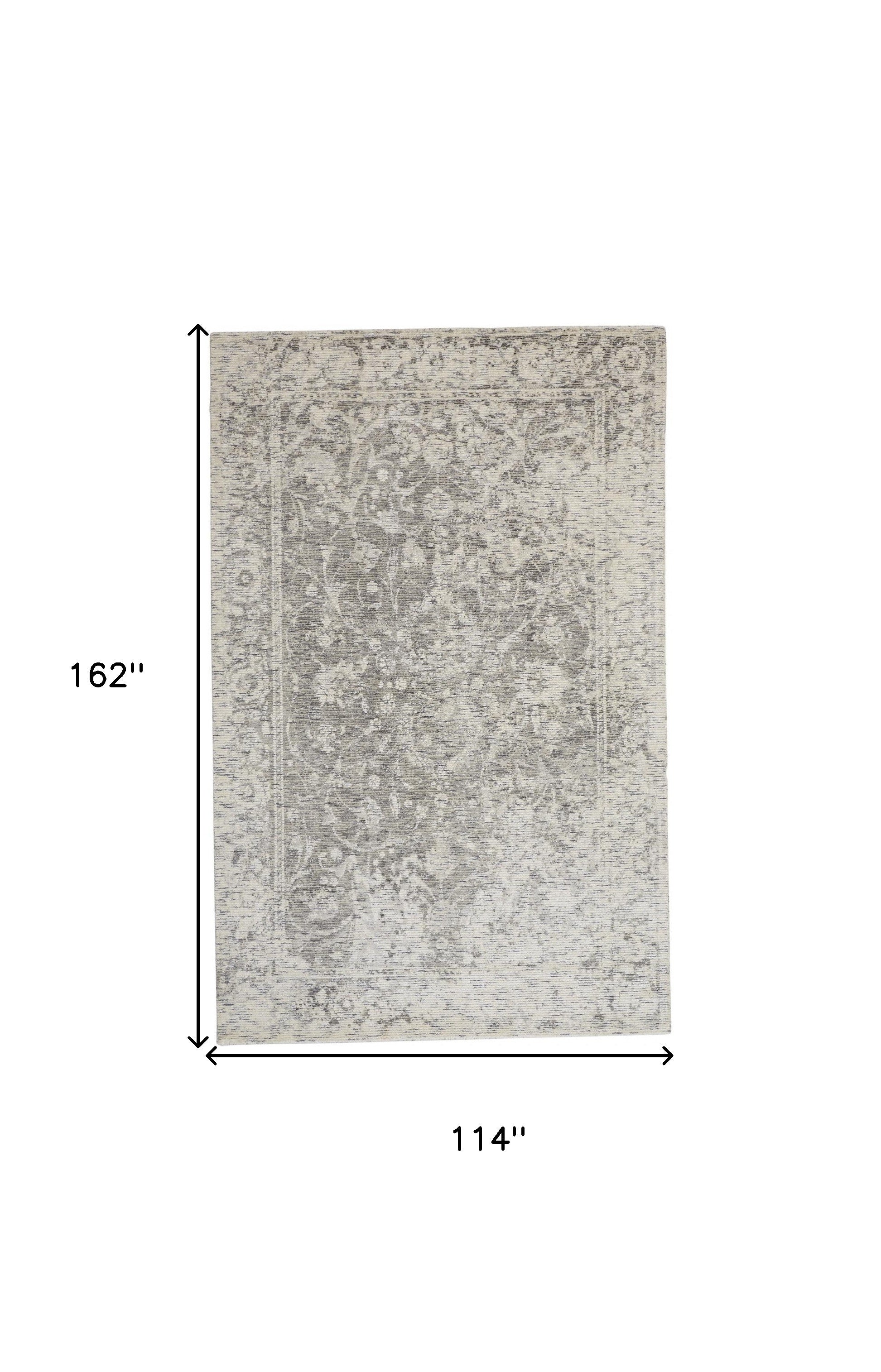 5' X 8' Ivory And Tan Abstract Hand Woven Area Rug