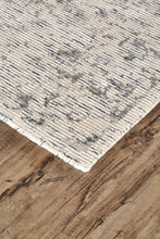 5' X 8' Ivory And Tan Abstract Hand Woven Area Rug