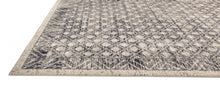 4' X 6' Ivory Black And Taupe Abstract Stain Resistant Area Rug
