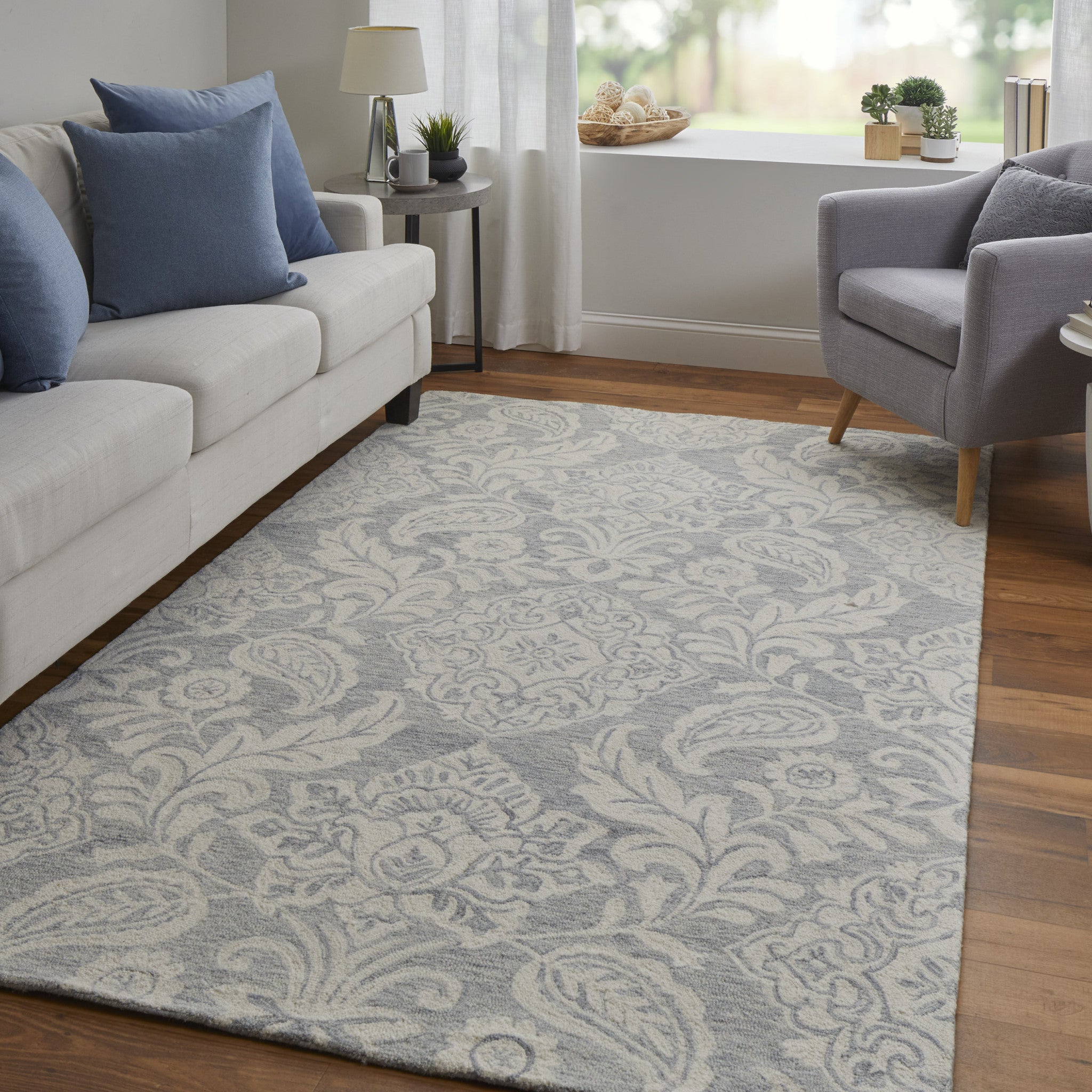 Blue And Ivory Wool Paisley Tufted Handmade Stain Resistant Area Rug - 5' x 8'