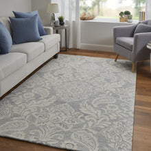 Blue And Ivory Wool Paisley Tufted Handmade Stain Resistant Area Rug - 5' x 8'