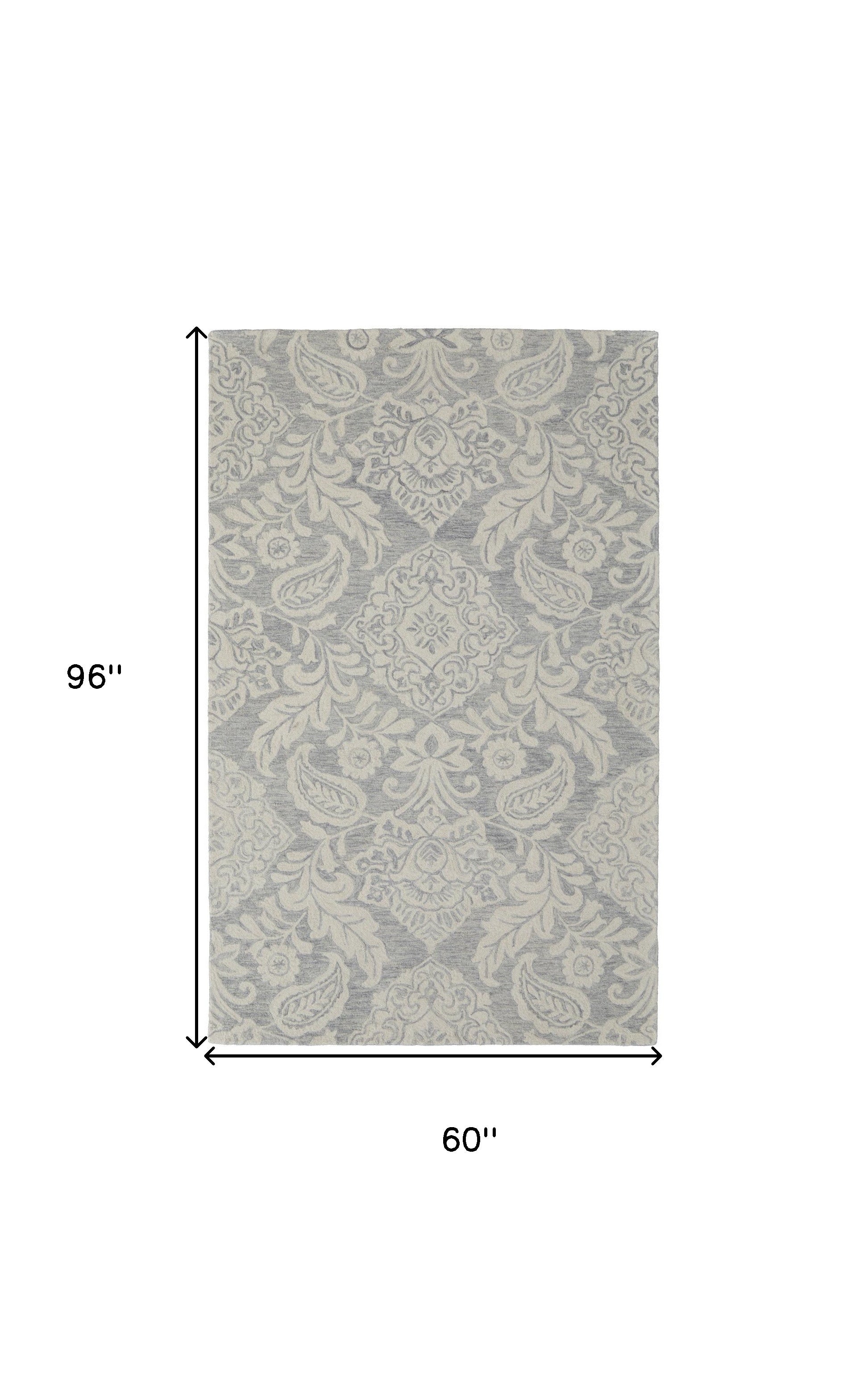 Blue And Ivory Wool Paisley Tufted Handmade Stain Resistant Area Rug - 5' x 8'