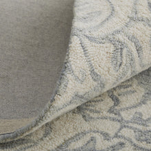 Blue And Ivory Wool Paisley Tufted Handmade Stain Resistant Area Rug - 5' x 8'